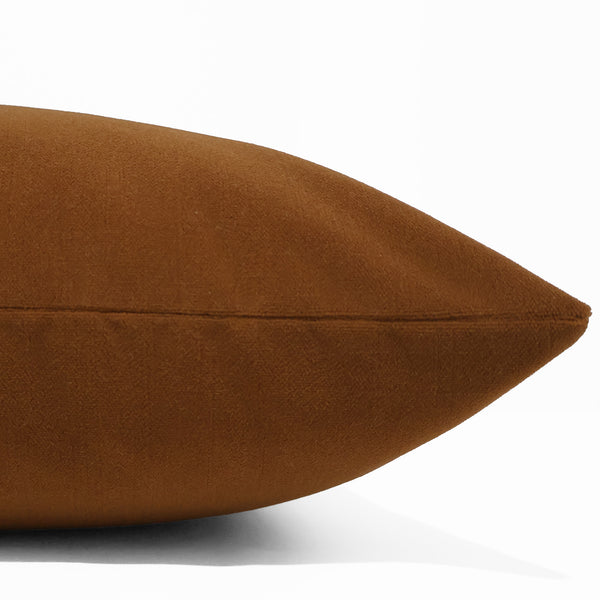 Cinnamon velvet pillow cover with smooth matte finish, front corner detail