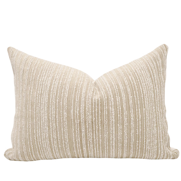 Close-up of dune boucle stripe lumbar fabric showing looped cream stripe texture on a tan woven base