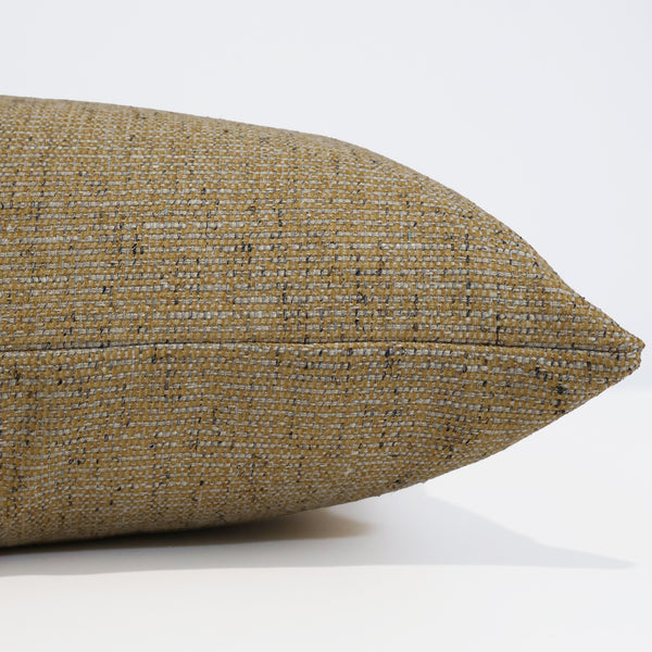 Antiqued Gold Pillow Cover in warm gold textured upholstery fabric with ivory and charcoal woven flecks, handmade by Hackner Home for luxury modern organic and traditional interiors. Side view of cushion cover.