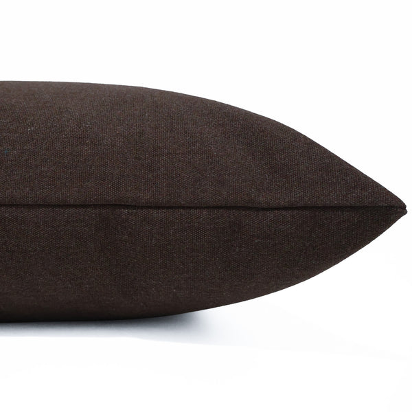 Burnt Walnut Pillow Cover in rich brown Sunbrella® indoor/outdoor performance fabric featuring subtle woven flecks of ivory, blue, red, and black, handmade by Hackner Home. Side view of cushion cover.