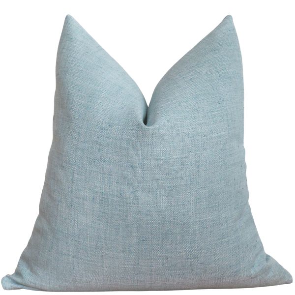 Light blue pillow on a white background