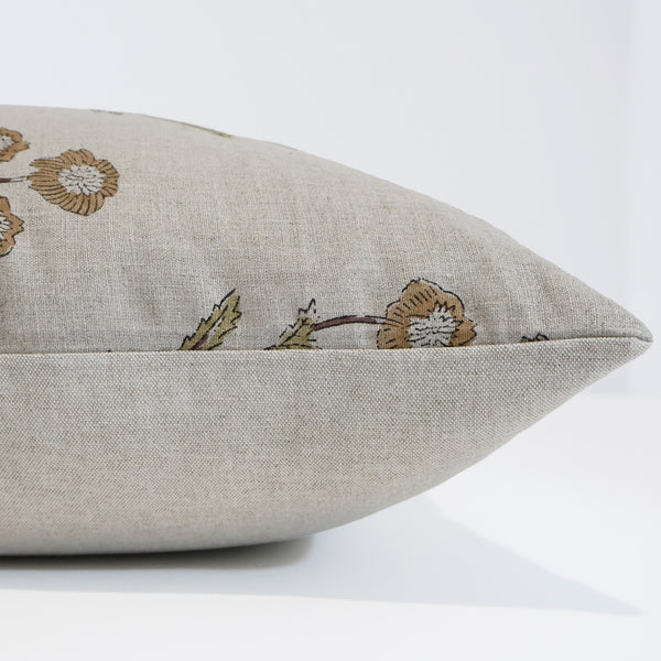 Golden Spring Botanical Pillow Cover featuring hand block printed golden yellow and sage green floral motifs on natural 100% linen, handmade by Hackner Home. Side View of cushion cover. 