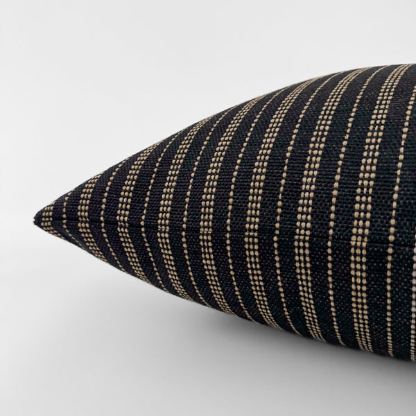 Jute Stripe decorative pillow cover handcrafted from premium 100% Olefin performance upholstery fabric featuring a rich blue-black woven texture with natural jute-inspired stripes, luxury designer accent pillow for organic modern, coastal, transitional, and contemporary interiors. Side view of Cushion Cover. 