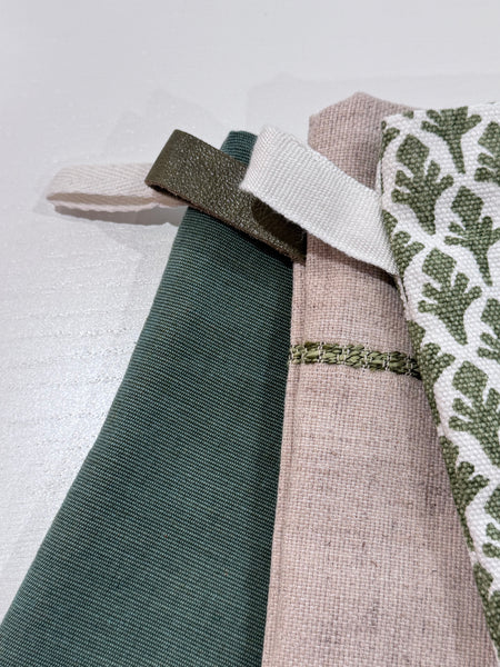 Close-up of the Boho Stocking Set of Three, showing the flax linen texture and leather hook detail.