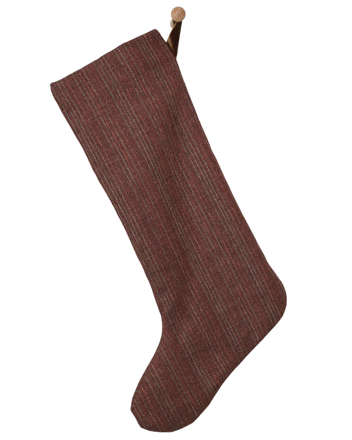 Large deep berry red handmade Christmas stocking with subtle textured woven stripes and minimalist silhouette by HACKNER HOME.