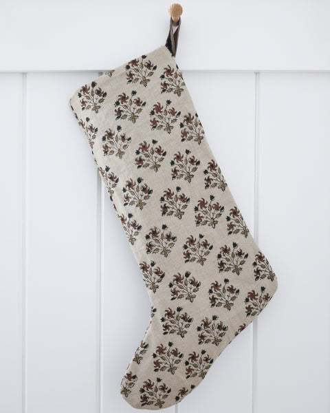 Large Design linen block print Christmas stocking in a floral pattern with a brown velvet hook loop, shown on a white background