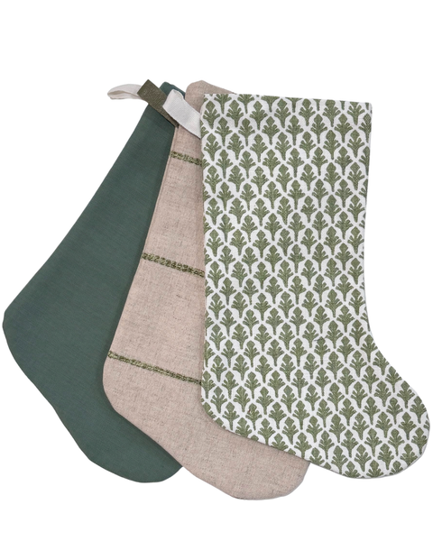 Boho Stocking Set of Three in Green, handmade in natural flax linen with rich green tones and leather hooks, by Hackner Home.