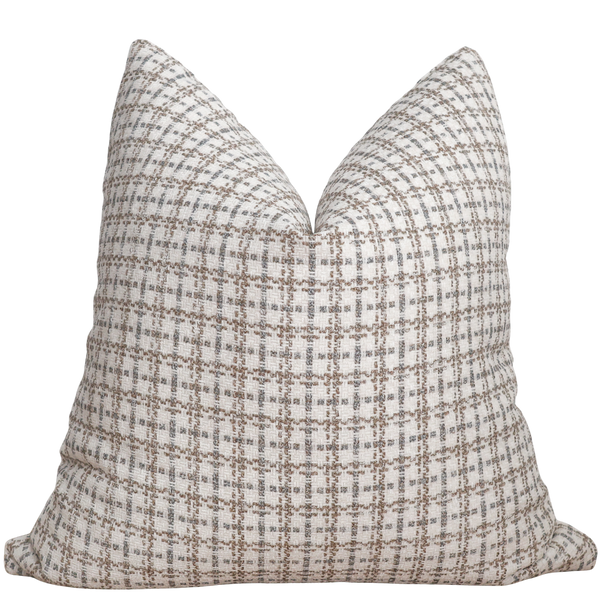 Plaid patterned pillow on a white background
