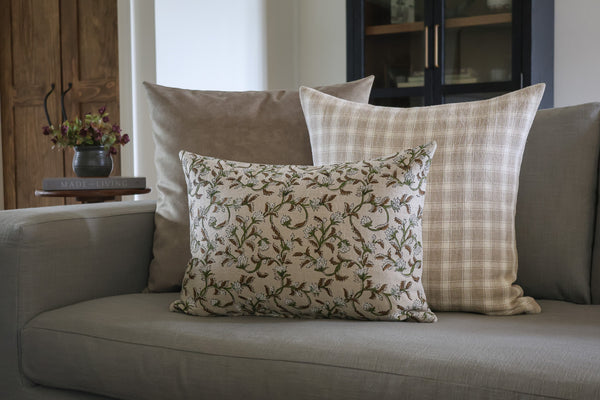 Sweet Autumn Clematis Block Print lumbar pillow cover featuring a brown, green and cream botanical floral design, layered with neutral plaid and solid designer pillows by HACKNER HOME.