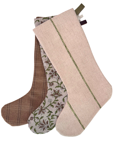 The Cottage Christmas Stocking Set of Three, handmade in wool plaid, hand block printed linen, and flax linen with leather and cotton twill hooks, by Hackner Home.