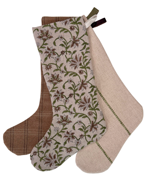 Close-up of the hand block printed linen floral stocking with a cotton twill hanging loop.