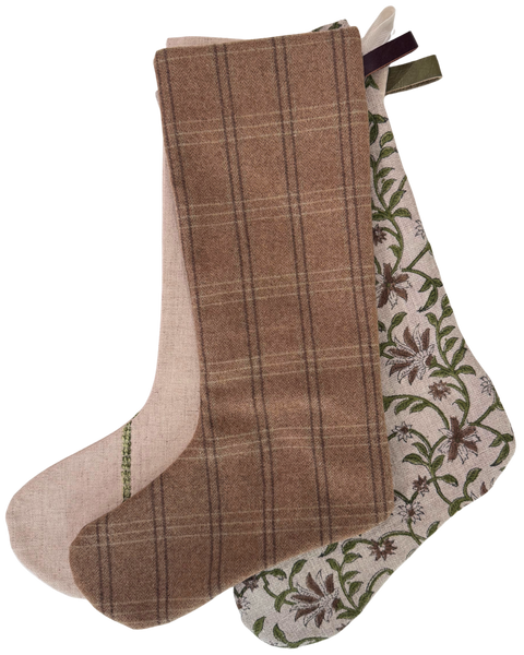 Close-up of the flax linen blend stocking with embroidered green stripes and a green leather hanging loop.