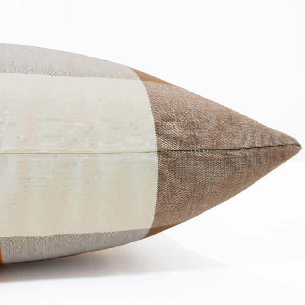 Side view of the Hackner Home Cider Plaid pillow cover showing the warm rust, tan, and cream check pattern with a smooth, tailored edge finish.