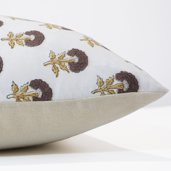 Side view of Hackner Home Dandelion Brown Floral Block Print pillow cover showing the detailed brown and gold floral pattern on ivory fabric with a neutral linen back panel.