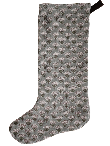 Muted blue floral block print Christmas stocking with a minimal, hand-stamped design and dark fabric loop for hanging.